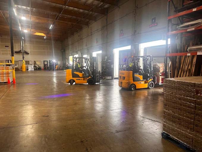 Forklift Moving Pallets At Our Facility